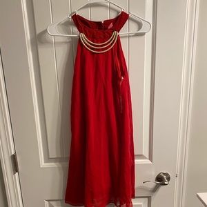 Tank top with gold necklace